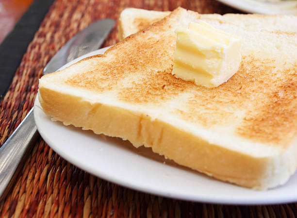 istock roast bread with butter on top and knife beside dish 182192978