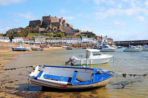 Gorey Harbour Jersey "Gorey Harbour and Mont Orgueil Castle in Jersey, Channel Islands" circa 14th century photos stock pictures, royalty-free photos & images