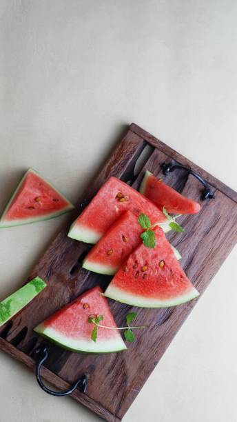 istock fresh sliced watermelon wooden background 1821932662