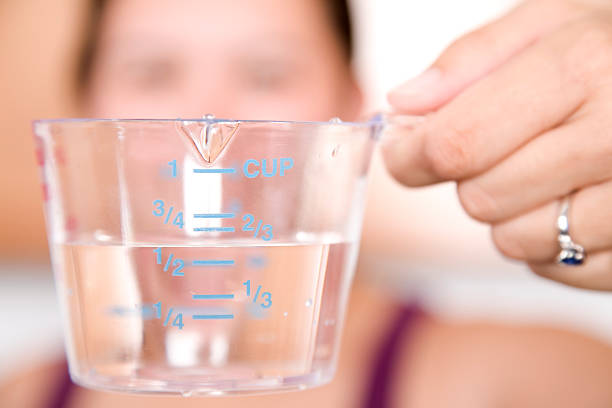 Closeup of Half Full Measuring Cup.