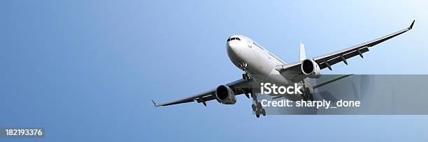 Jet Airplane Landing In Blue Sky Stock Photo - Download Image Now - Air Vehicle, Airplane, Above