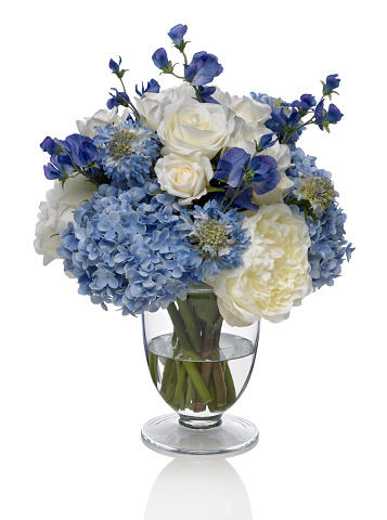Beautiful mixed hydrangea and peony bouquet in a footed vase. The image has an embedded path which may be used to delete the reflection if desired.  Photographed on a bright white background. Extremely high quality faux flowers.ns