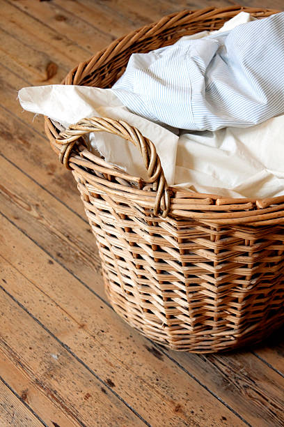 istock Laundry basket on wooden floor 182194186