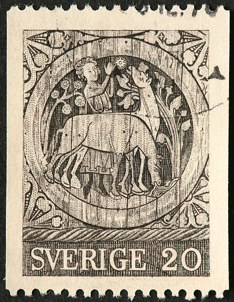 istock carving of man with animals 182194446