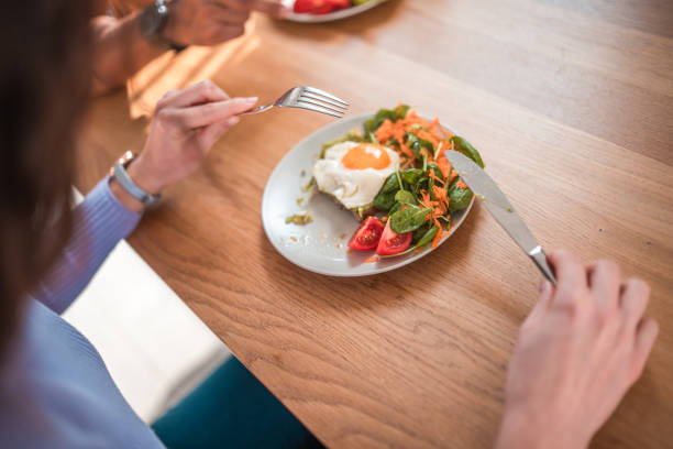 istock Caucasian Female Eating Breakfast At Home 1821951184