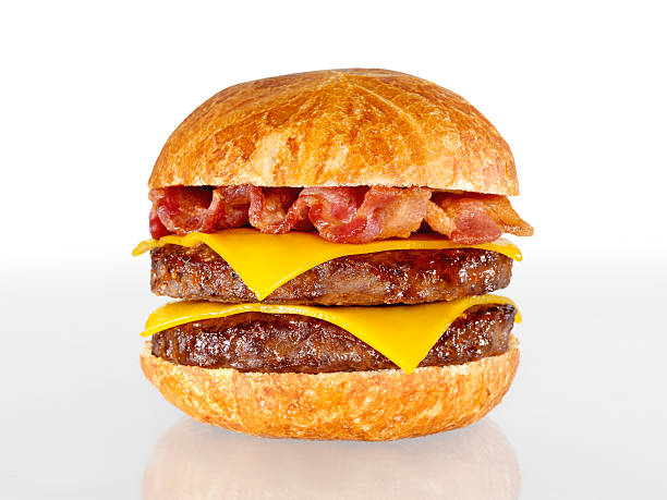 Bacon Double Cheeseburger Bacon Double Cheeseburger with Natural Shadow and Gradation-Photographed on Hasselblad H3D-39mb Camera bacon cheeseburger stock pictures, royalty-free photos & images