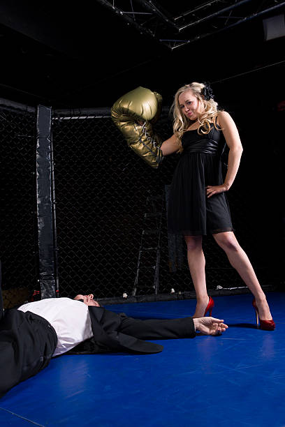 istock Woman Knocks Out Businessman 182197480