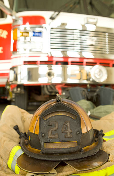 istock Firefighter's Helmet, Jacket and Fire Truck 182197844