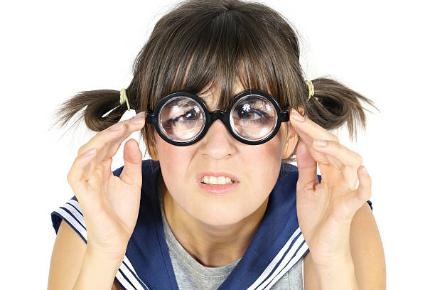 funny girl in thick lens glasses stock photo