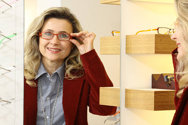 istock woman trying new eyeglasses 182198153