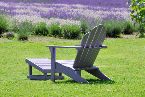 Beautiful spa scene with lavender and lawn chair.