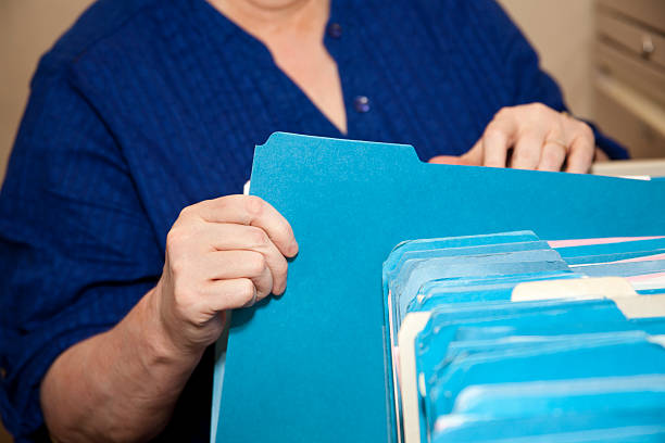 istock Woman filing in an office. 182198313