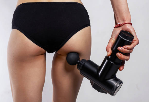 istock Massage gun on different body parts. Handheld cordless professional percussion deep tissue body muscle fascia massager for athletes isolated on white background. 1821986387