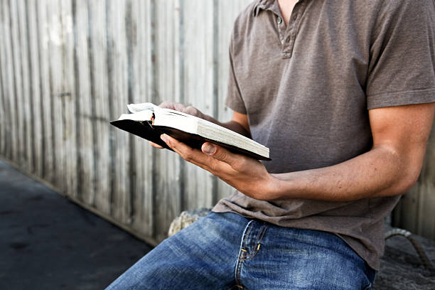 Man reading his Bible stock photo