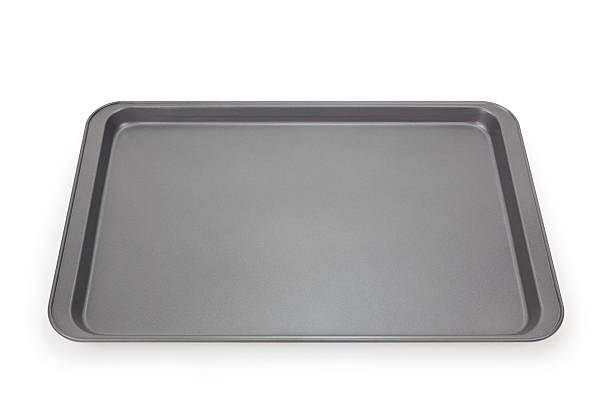 Baking Sheet "Empty baking sheet isolated on white, with clipping path.Please also see:" polytetrafluoroethylene photos stock pictures, royalty-free photos & images