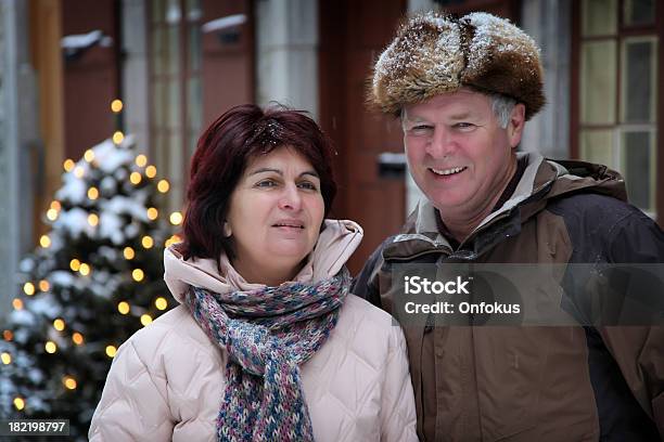 Happy Seniors Couple Outdoor At Christmas Time Stock Photo - Download Image Now - Canada, Senior Adult, Travel