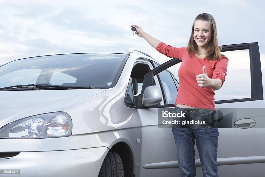 Teenage girl holding keys of new car Car Stock Photo