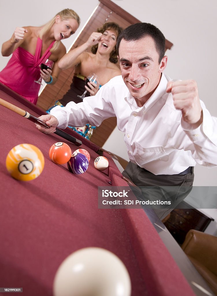 Pool Player Successfully Hitting the Ball In Pool Player Successfully Hitting the Ball In. Adult Stock Photo