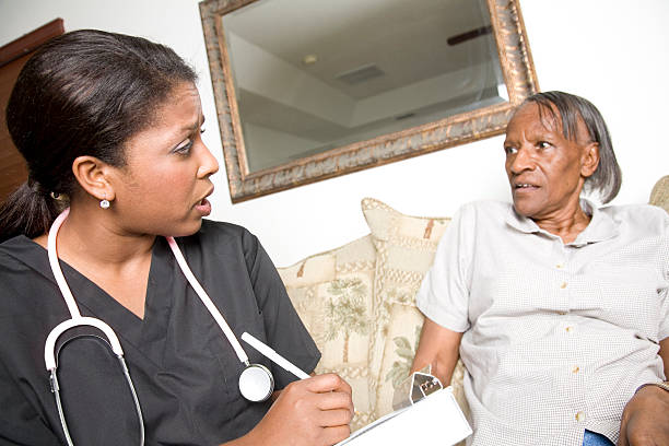 istock Concerned Nurse Performing Check Up With Her Elderly Patient 182199325