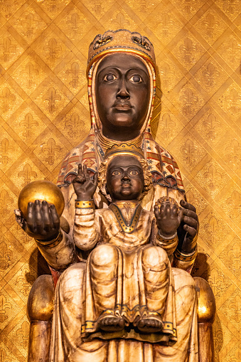 Gothic statue of Black Virgin or La Moreneta with Jesus sitting on her knees in Barcelona Cathedral, one of two patron saints of Catalonia
