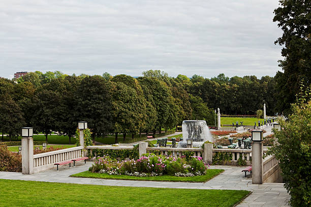Park in Oslo with fountain and roses.. "Fountain and roses in a park. Gustav Vigeland Sculptur park, Oslo, NorwayOslo, Norway.Fountain in Gustav  Vigeland's, sculpture park in Oslo, Norway.Lightbox:" norway autumn oslo tree stock pictures, royalty-free photos & images