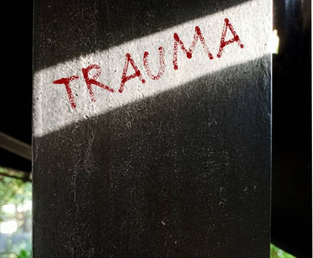istock Cement post with handwriting text Trauma -  person's emotional response to a distressing experience,  lasting emotional response results from intensely stressful  events 1822008634