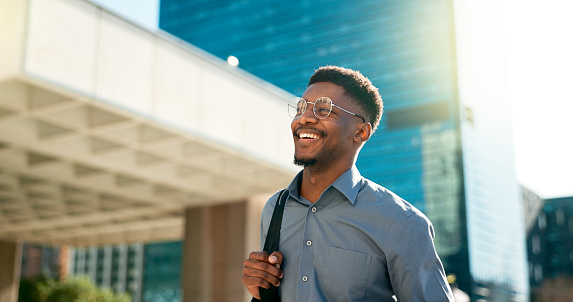 Business, happy and walking black man on city journey, commute trip and real estate agent smile on way to office building. Happiness, career expert and African real estate agent on morning travel in Nigeria