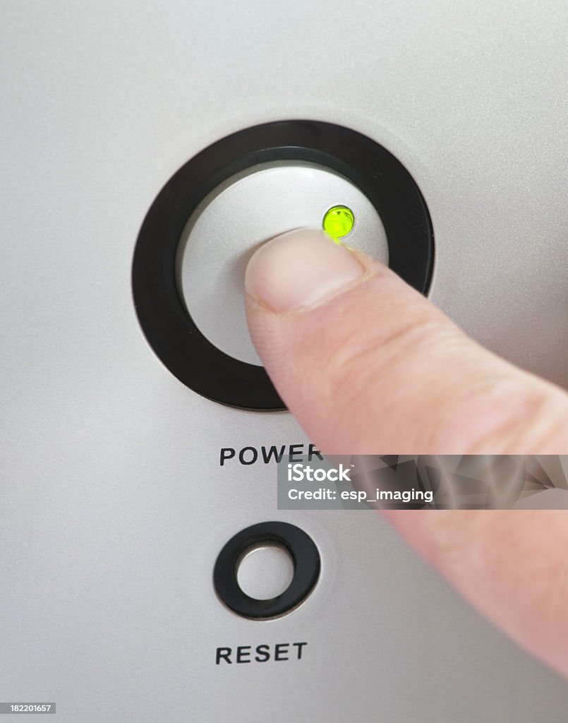 Pressing the power switch on or off Pressing the power switch on or off on a computer. See also: Push Button Stock Photo