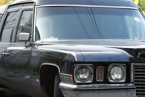 Closeup 3/4 View of a Black 1972 Cadillac Hearse.