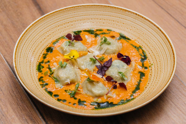 ricotta and spinach ravioli with dumplings served in plate isolated on table side view of italian fastfood - appetizer people marinara cheese imagens e fotografias de stock