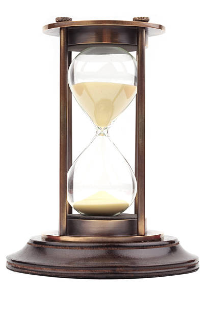 istock isolated vintage hourglass with wooden base 182204026