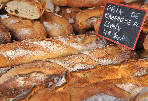 istock Stack of crusty French bread at the market 182204255