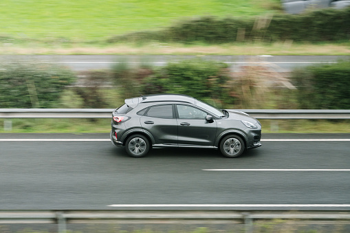 Santander, Spain - 29 November 2023: A modern Ford Puma SUV car in motion on a highway