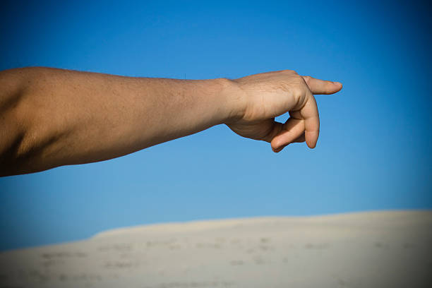 arm pointing out a direction. stock photo