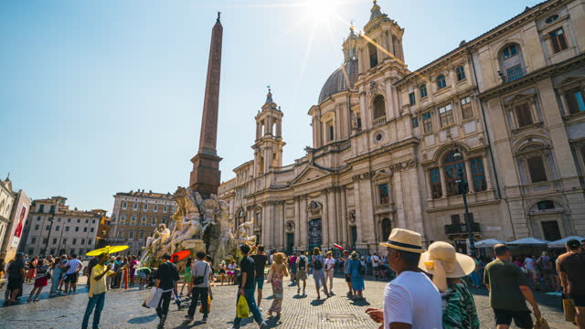 Time lapse of Crowd of People tourist walking and sightseeing attraction at Piazza Navona elegant square with Fiumi Fountain and Obelisco Agonale, street artists & bars in summer in Rome, Italy