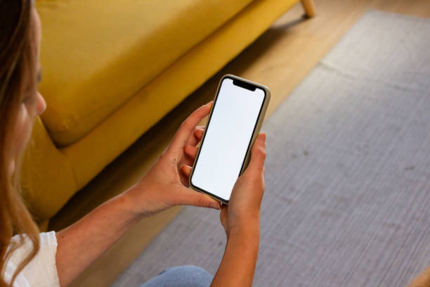 istock Mockup image of a woman's hands holding a smartphone with a blank white screen 1822044867