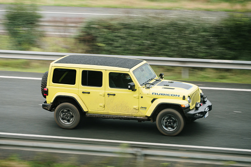 Santander, Spain - 29 November 2023: A Jeep Wrangler Rubicon in motion on a highway