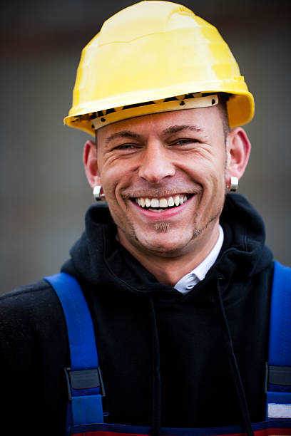 istock Happy Manual Worker In Yellow Hardhat 182204828