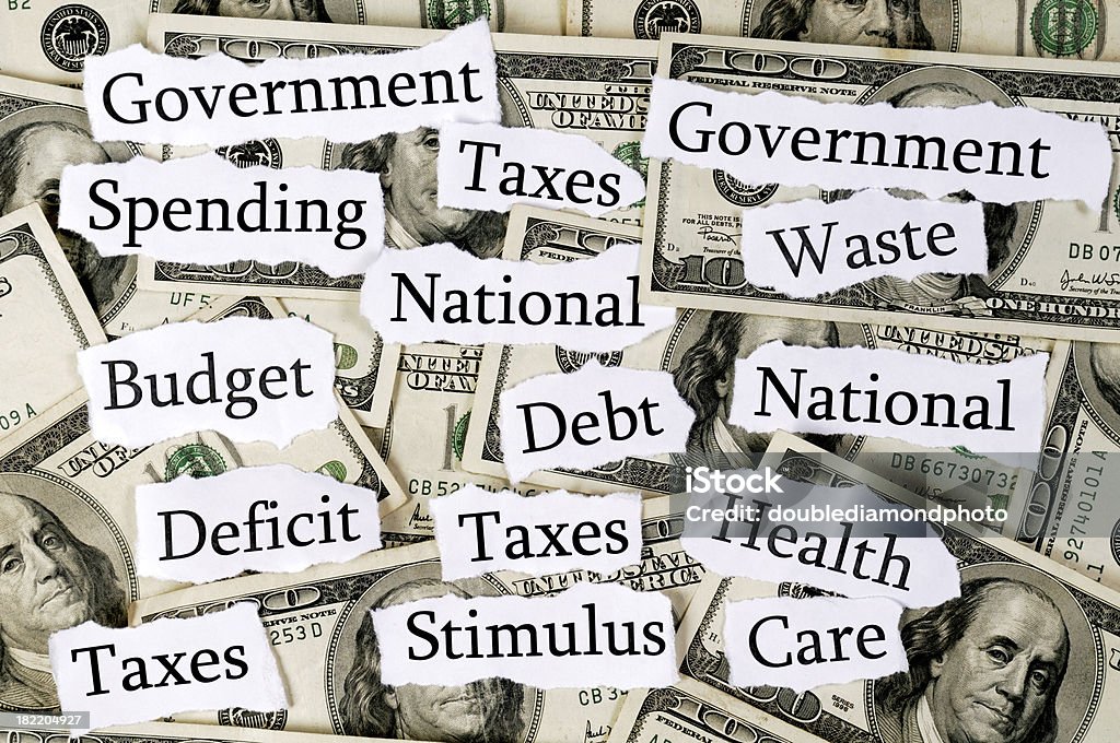 Government Spending A group of words dealing with government spending on one hundred dollar bills Government Stock Photo