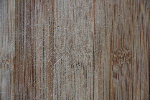 Wood panel with a traces of cuts, background, vertical texture