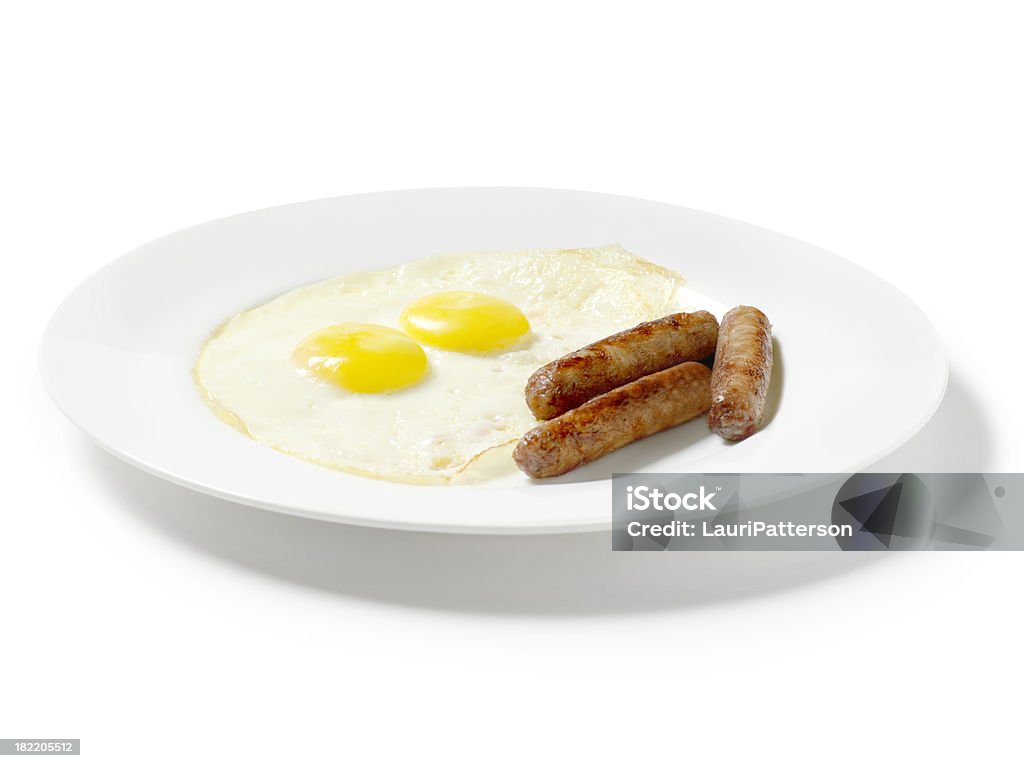 Huevos fritos con desayuno salchichas - Foto de stock de Alimento libre de derechos