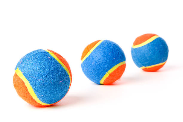 istock Three brightly lit colorful tennis balls 182206736
