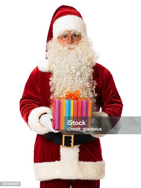 Santa Segurando Um Presente - Fotografias de stock e mais imagens de Adulto - Adulto, Branco, Brinquedo