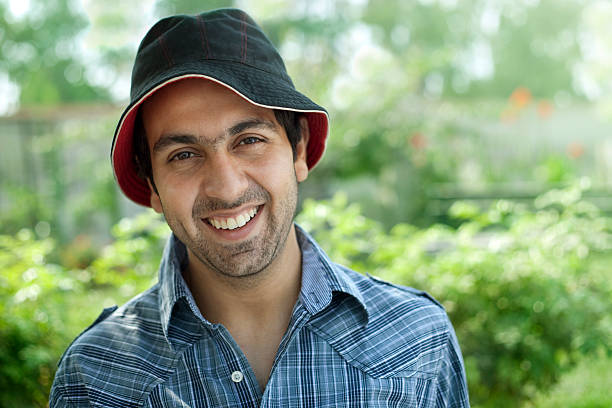istock Confidant young man smiling in park 182207267