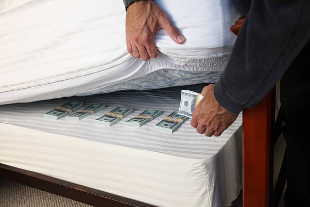istock Hiding Money Under The Mattress 182208143