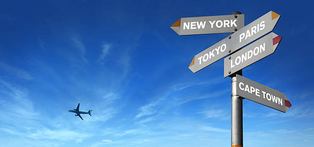 istock Signpost with Five City Directions and Flying Airplane 182208261