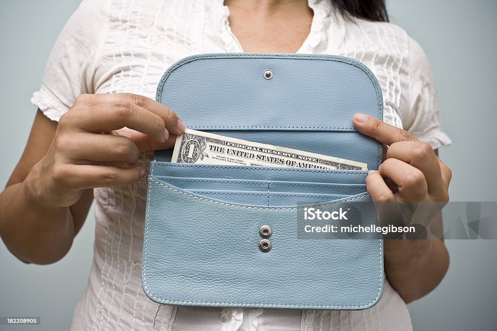 Saving Money Woman holds wallet with one American dollar bill Abstract Stock Photo