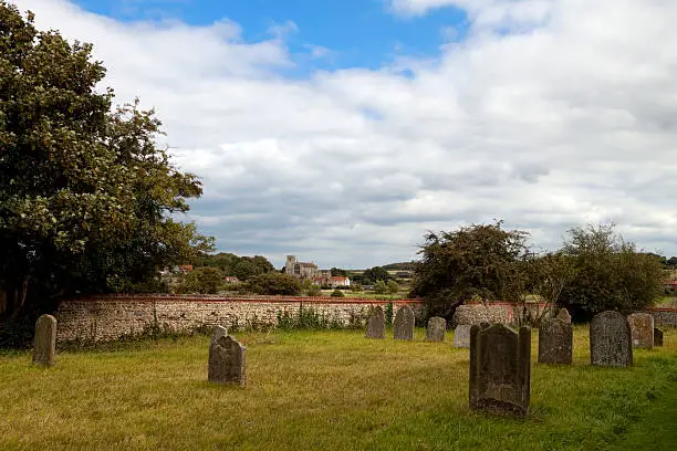 Photo of Cley church seen from Wiveton churchyard