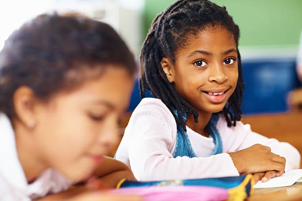 istock Cute school girls in the classroom 182209138