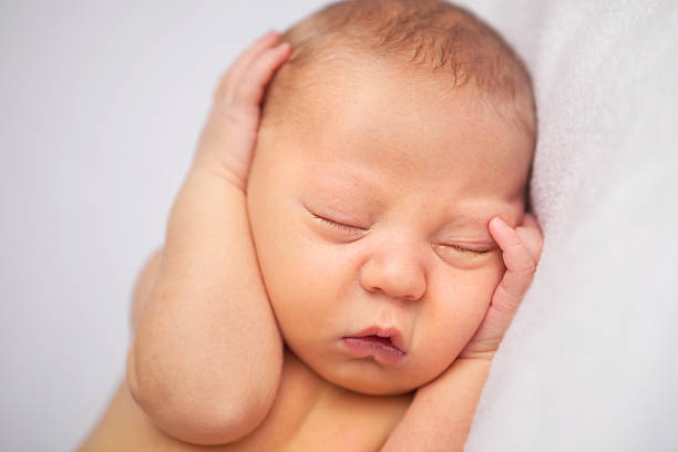 istock Newborn Baby Sleeping Peacefully - Headshot 182209189